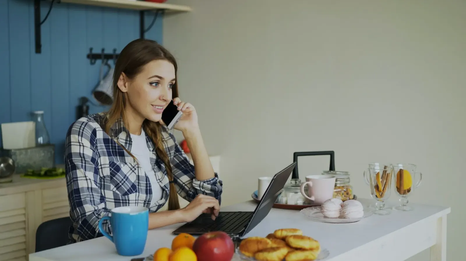 Woman smiling on a phone call at home